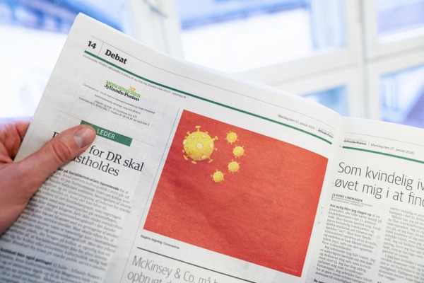 日德兰邮报出刊的漫画将中国五星旗改为五枚冠状病毒。