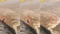 湖南男子洪水边捕鱼撒网6秒遭洪水吞没(图)