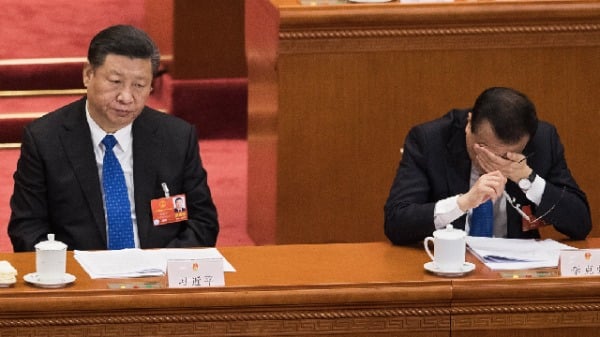 圖為2018年3月13日，習近平與李克強在北京開人大會議