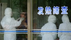 武漢「不明肺炎」潛伏期長國際關注(圖)